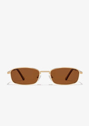 A pair of square-framed sunglasses with a metallic gold finish and amber brown lenses.